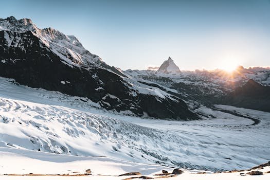 Capture of the majestic Swiss Alps and glacier at sunrise in winter, near Zermatt, Switzerland.